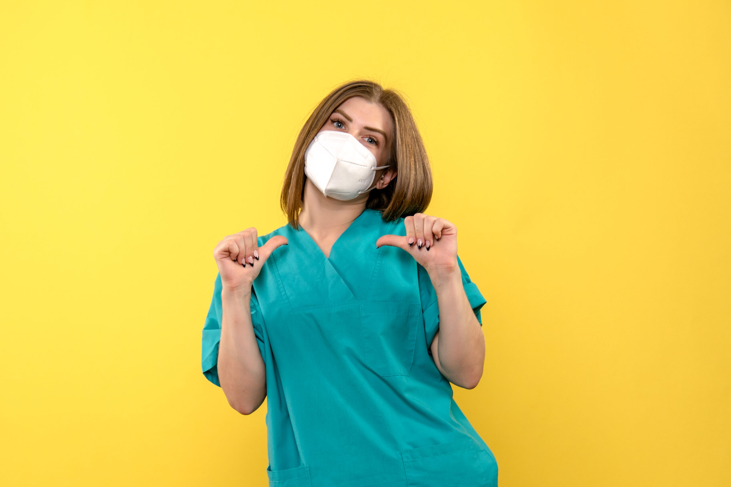 front view female doctor on yellow background pandemic hospital