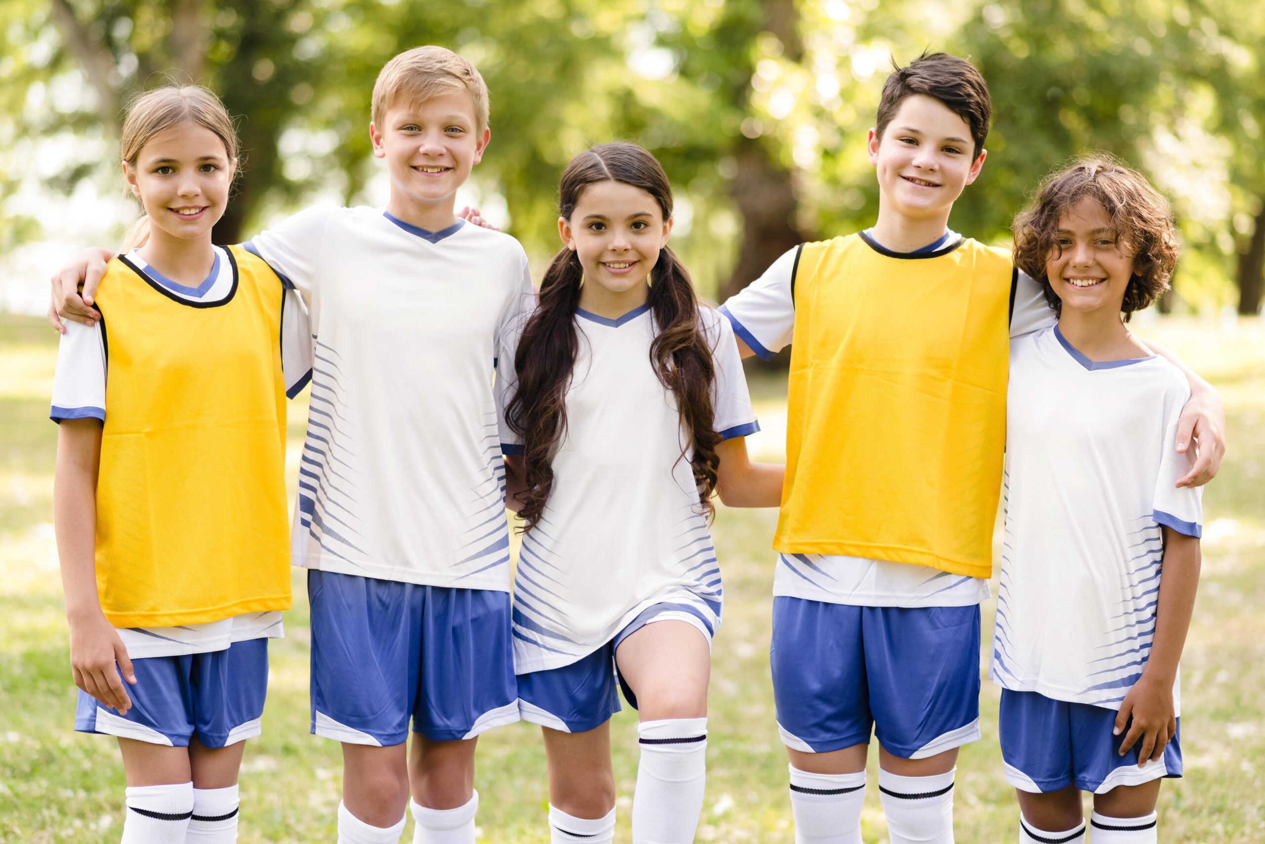 front view kids football sportswear holding each other